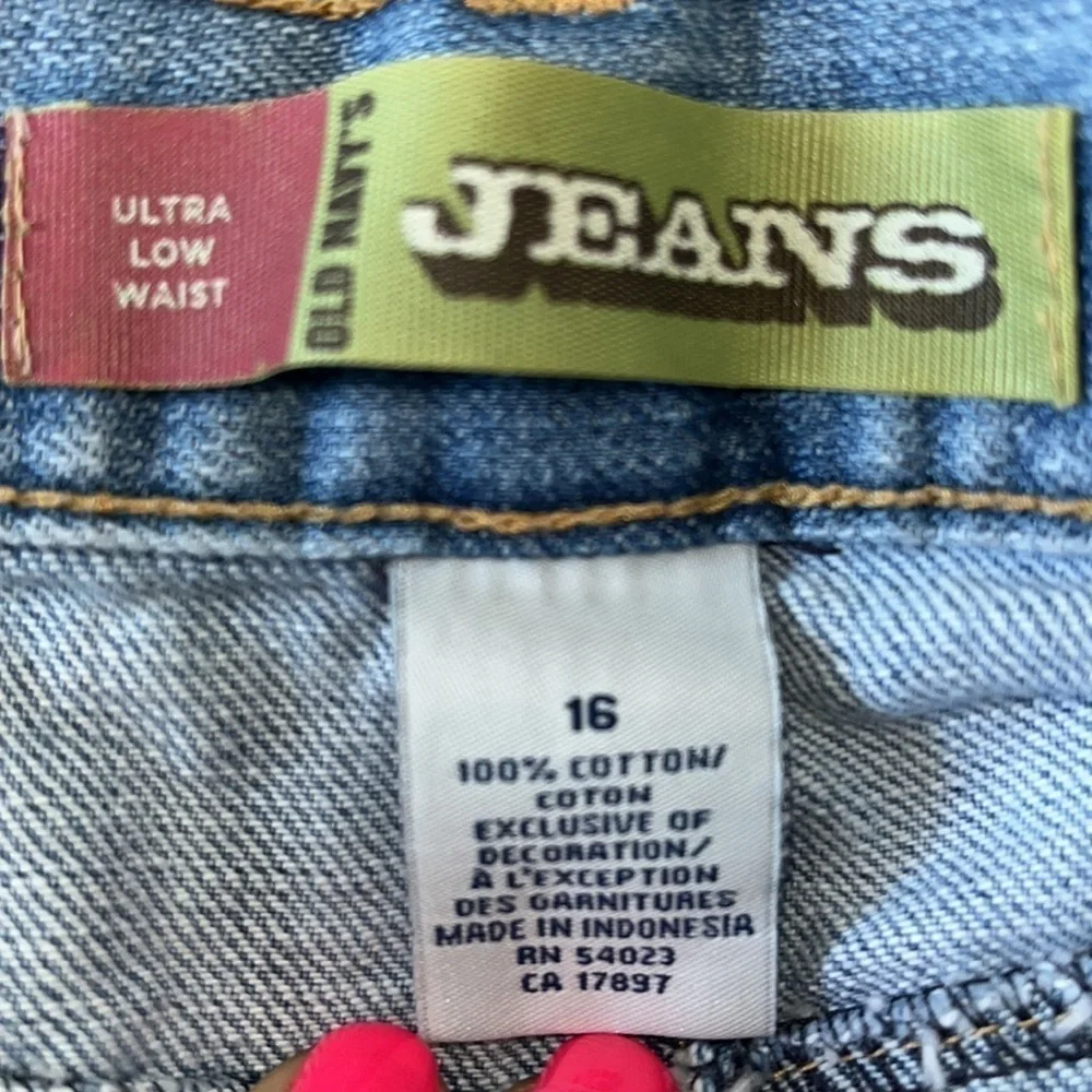 Old Navy’s Jeans ultra low waist stonewashed boho distressed frayed mini skirt.